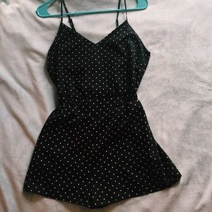Black polka-dotted romper